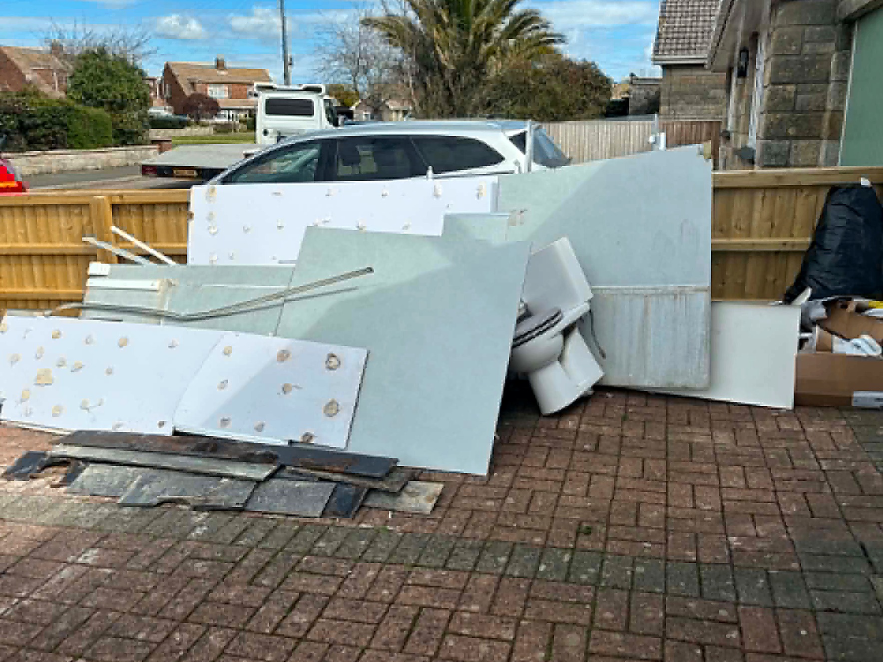 Bathroom strip-out waste collected from a driveway